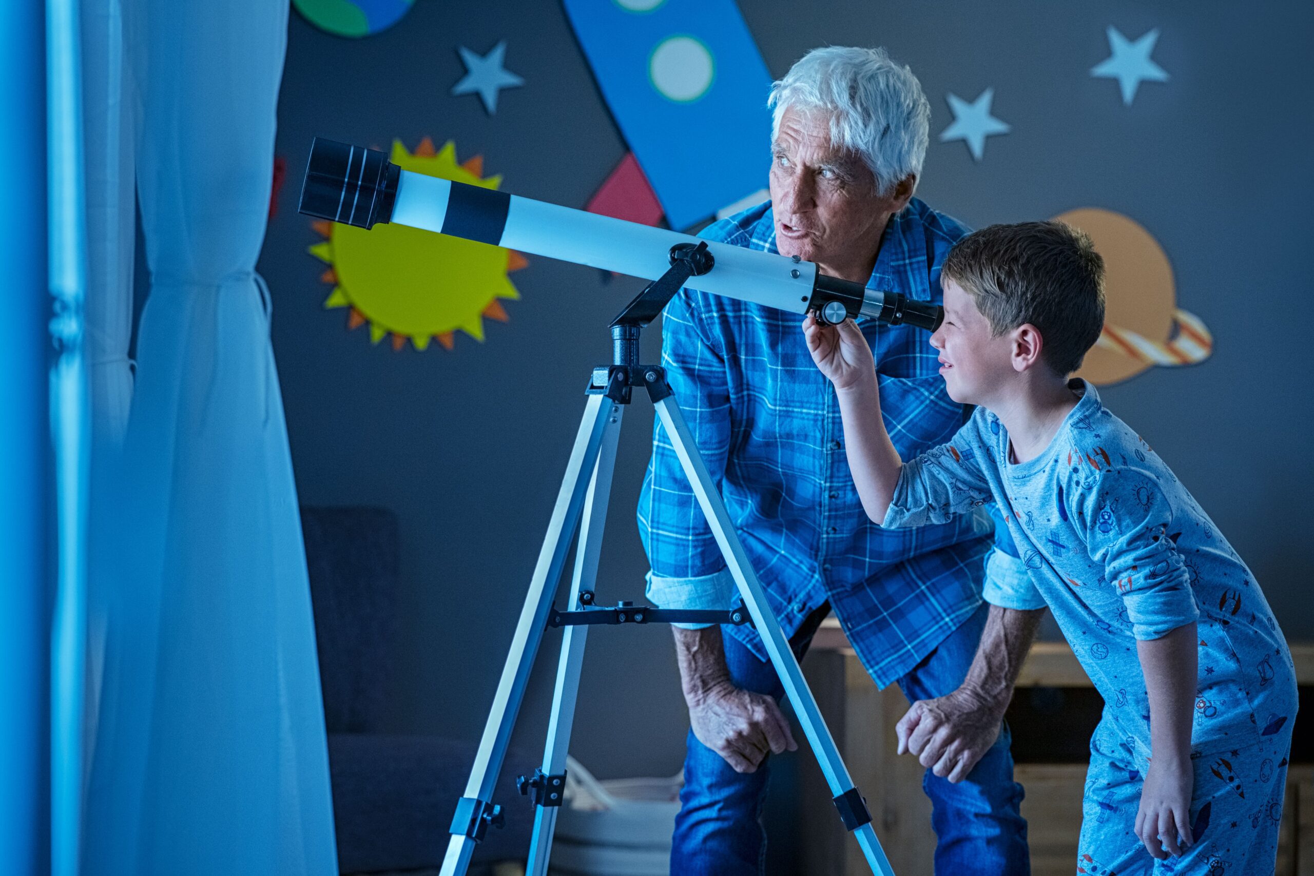 child-with-grandfather-using-telescope-during-nigh-2023-11-27-04-56-24-utc-min