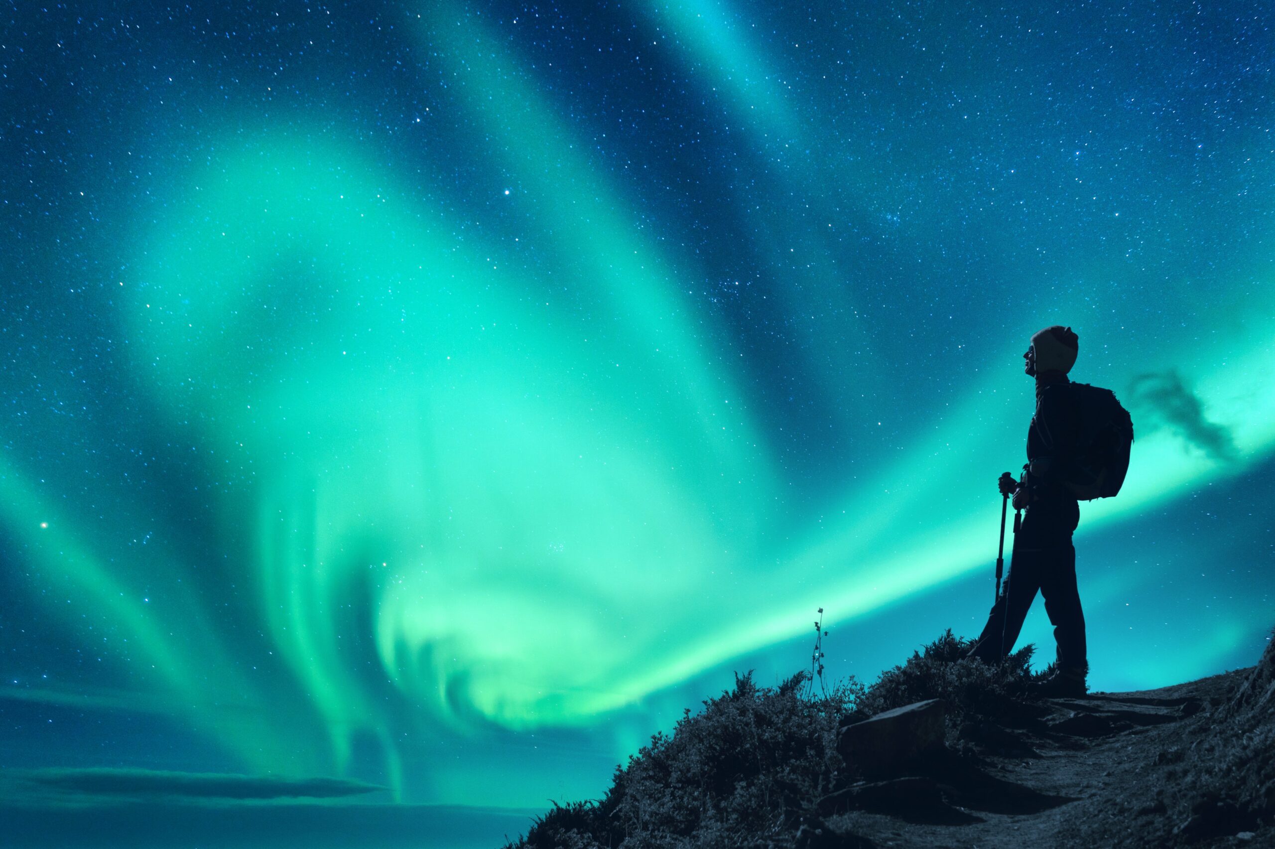 aurora-borealis-and-silhouette-of-a-woman-with-bac-2023-11-27-05-30-57-utc (1)-min